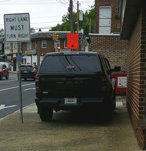 SUV parked on sidewalk