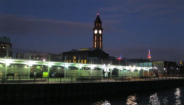 Outside at night with the light rail station in the foreground